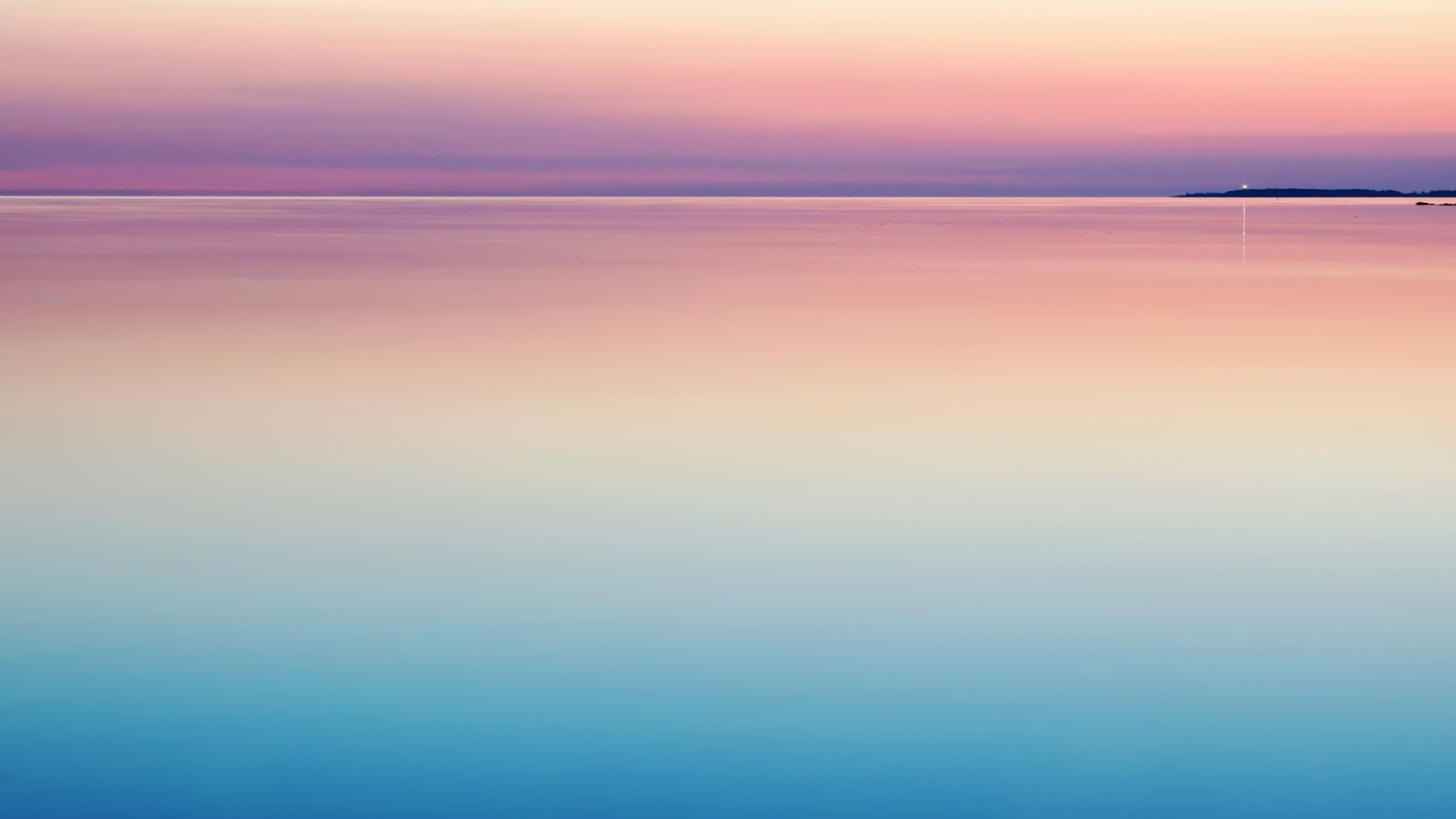 Calm sea at dusk, blue and pink light